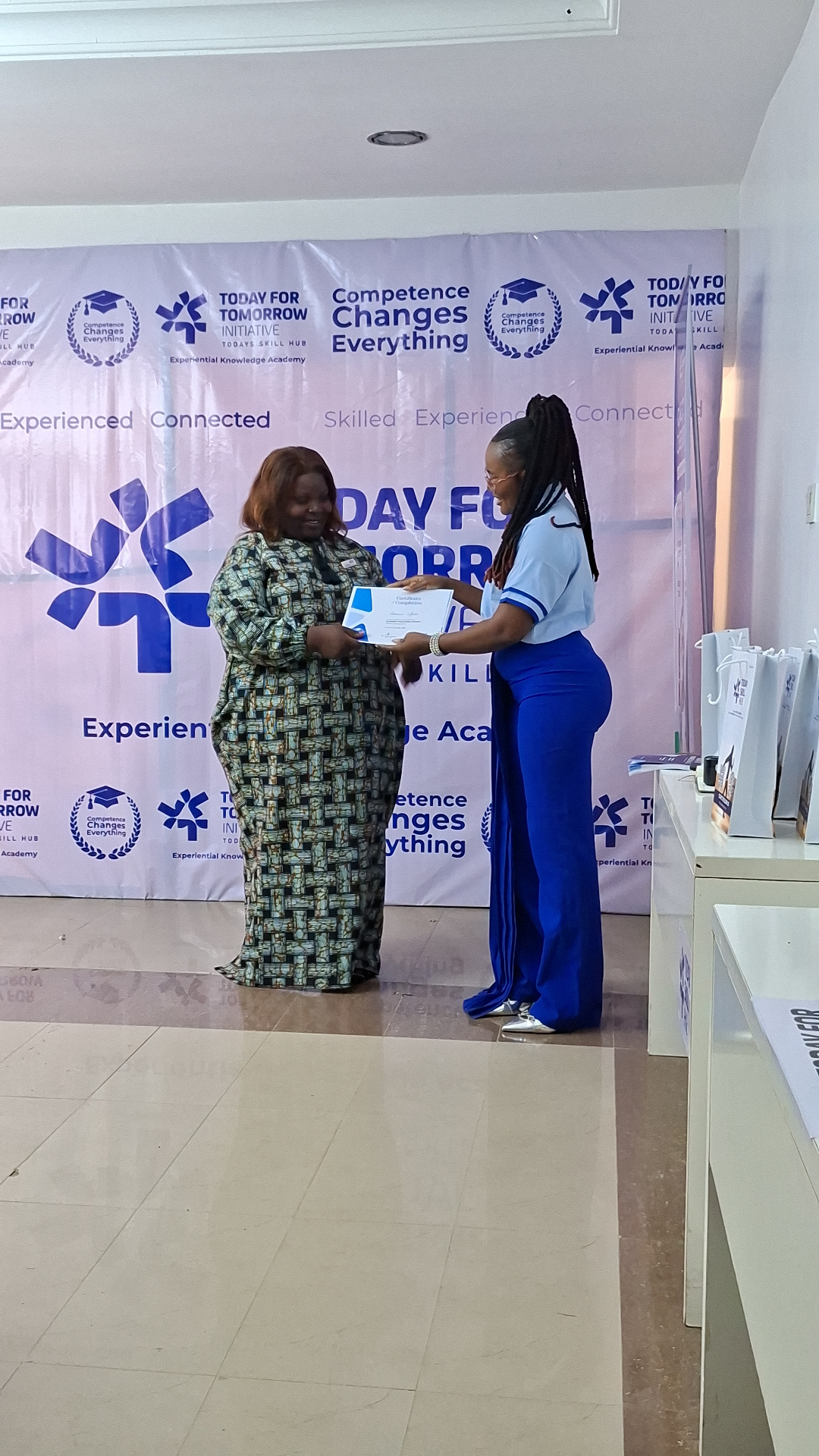 Certificate presentation moment at Today For Tomorrow event