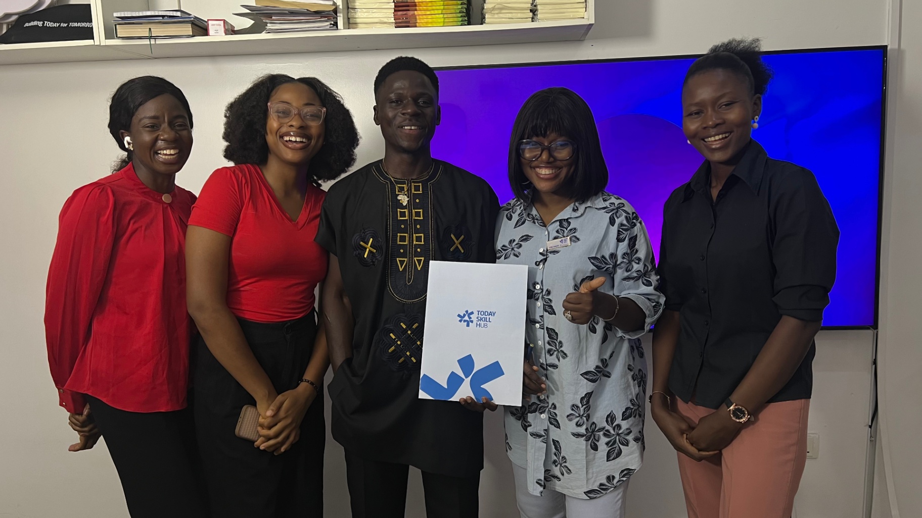 Team and graduates holding TFT-TSH portfolio
